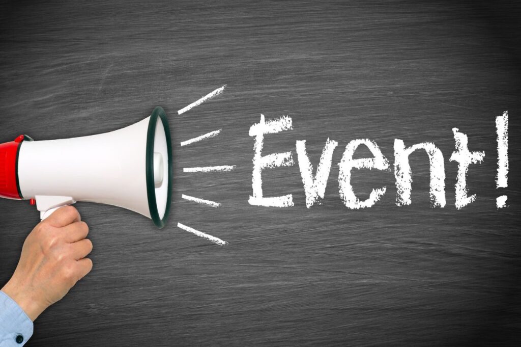 A hand holds a megaphone directed at the word "Event!" written in chalk on a blackboard background.